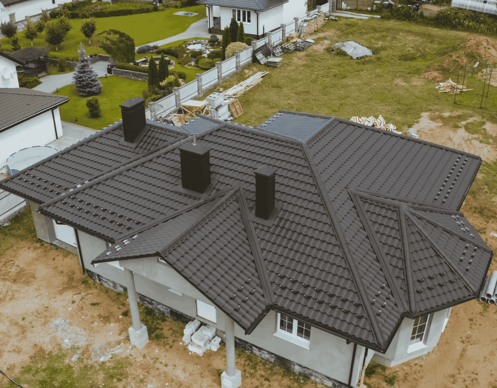 Professional roofer repairing damaged asphalt shingles on residential roof in Central Florida