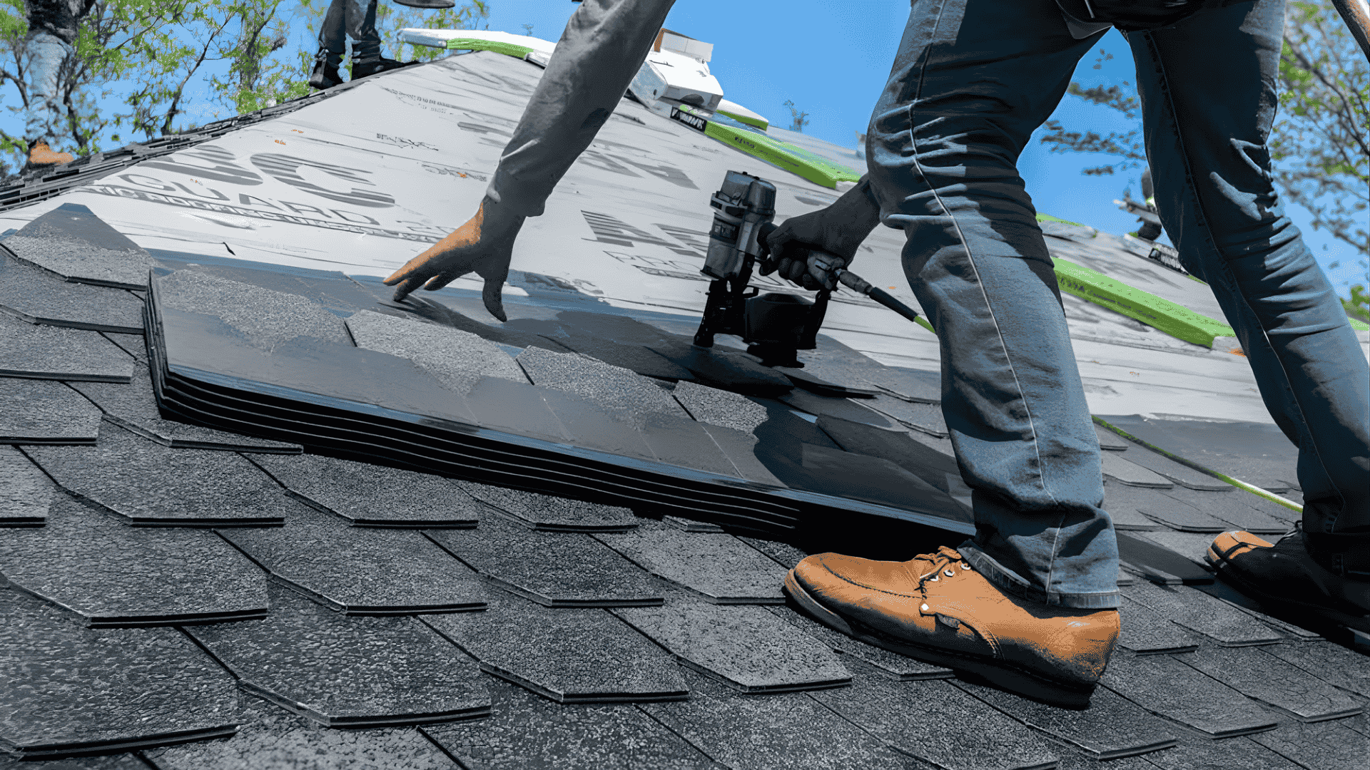 Roofing crew performing roof repair on residential home in Central Florida